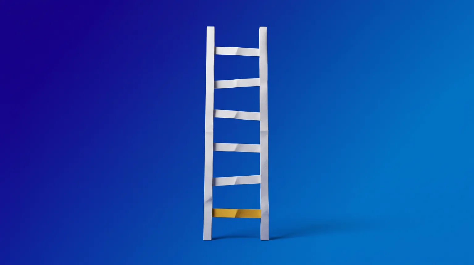 A folded white paper ladder standing on deep blue, its lowest rung picked out in gold.