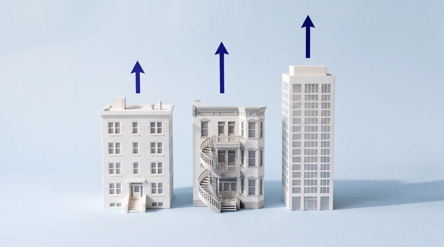 Three paper-craft apartment buildings on a pale blue background, each with a blue arrow of a different height above it.